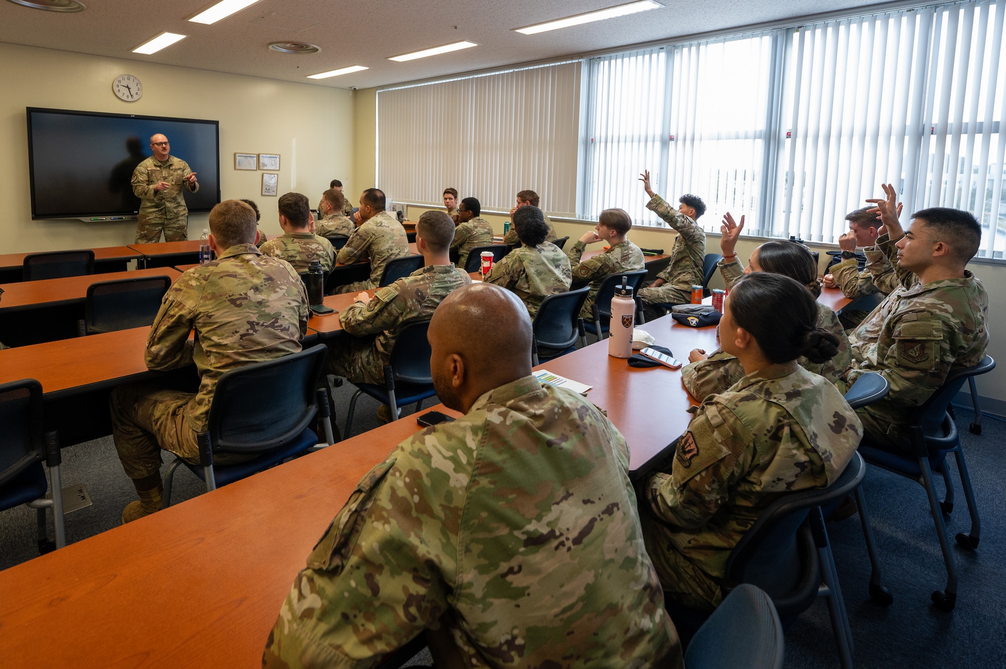 U.S. Air Force Senior Master Sgt. Ryan Cullen, 67th Fighter Generation Squadron sortie support superintendent, speaks to participants.