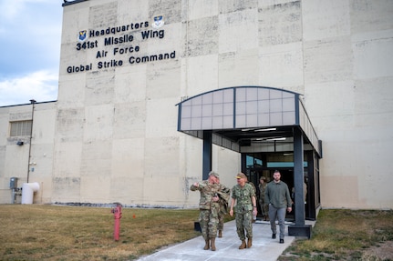 People walking out of a building.