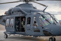 A man sitting inside of a helicopter