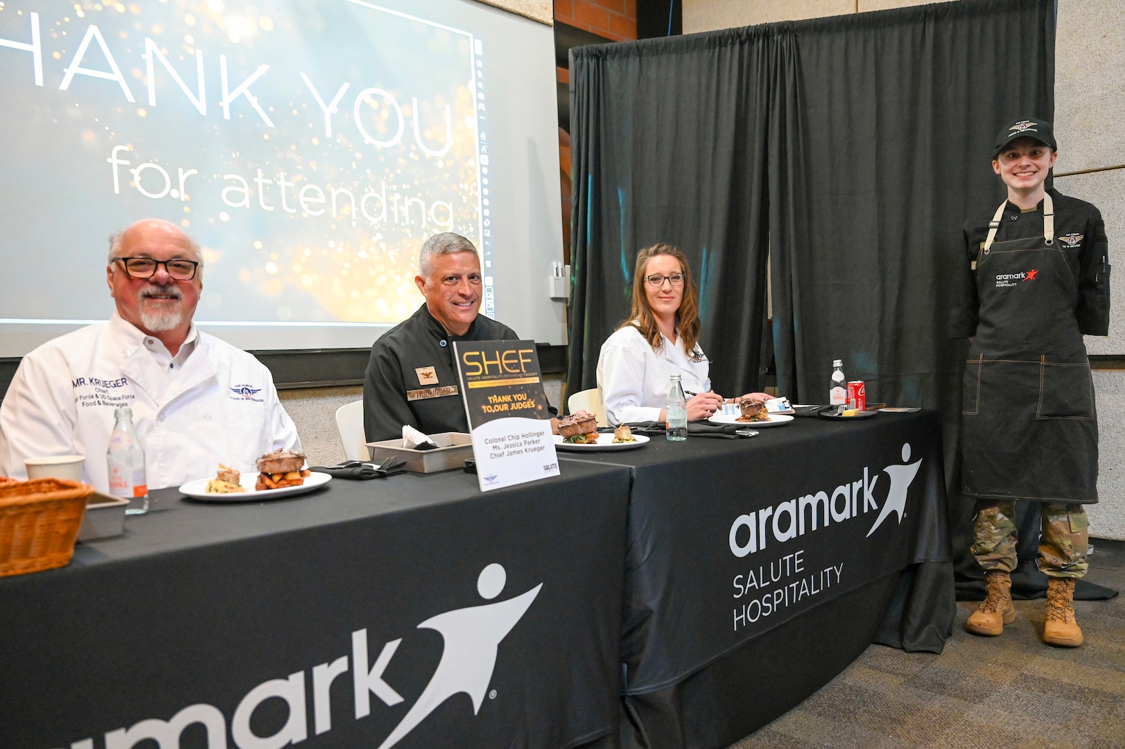 Airman poses with judges