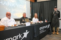 Airman poses with judges