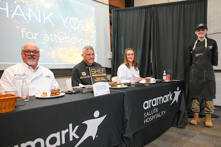 Airman poses with judges
