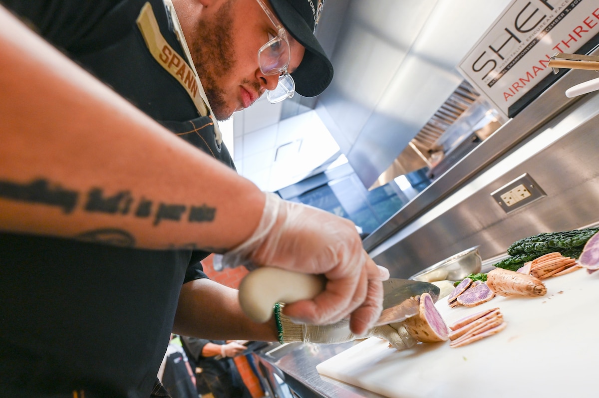Airman cuts sweet potato