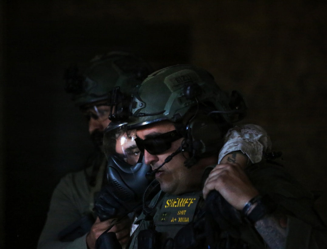 Marines and interagency partners engaged in an Interagency Active Shooter and Mass Casualty Exercise on the Yermo Annex aboard Marine Corps Logistics Base Barstow, 10 December 2025.
“This full-scale regional command training and interoperability exercise is designed to enhance emergency preparedness and rapid response capabilities to violent incidents,” said Maj Burnett, director of Operations. “The exercise involved coordination with key interagency partners, including local law enforcement, local fire and emergency services, as well as federal law agencies.”
Personnel and other resources from the San Bernardino County Sheriffs Office, Naval Criminal Investigation Services, Barstow Fire, California Highway Patrol, Federal Bureau of Investigation, and Mercy Air worked closely with the Provost Marshal’s law enforcement officers, Fire and Emergency Services’ firefighters and paramedics, Dispatch teams, and Base Operations to conduct simulations in-order-to test installation’s emergency response protocols for active shooters and mass casualty incidents.
This complex and multi-faceted training brings together our local agencies and improves communications, working relations, and team building.