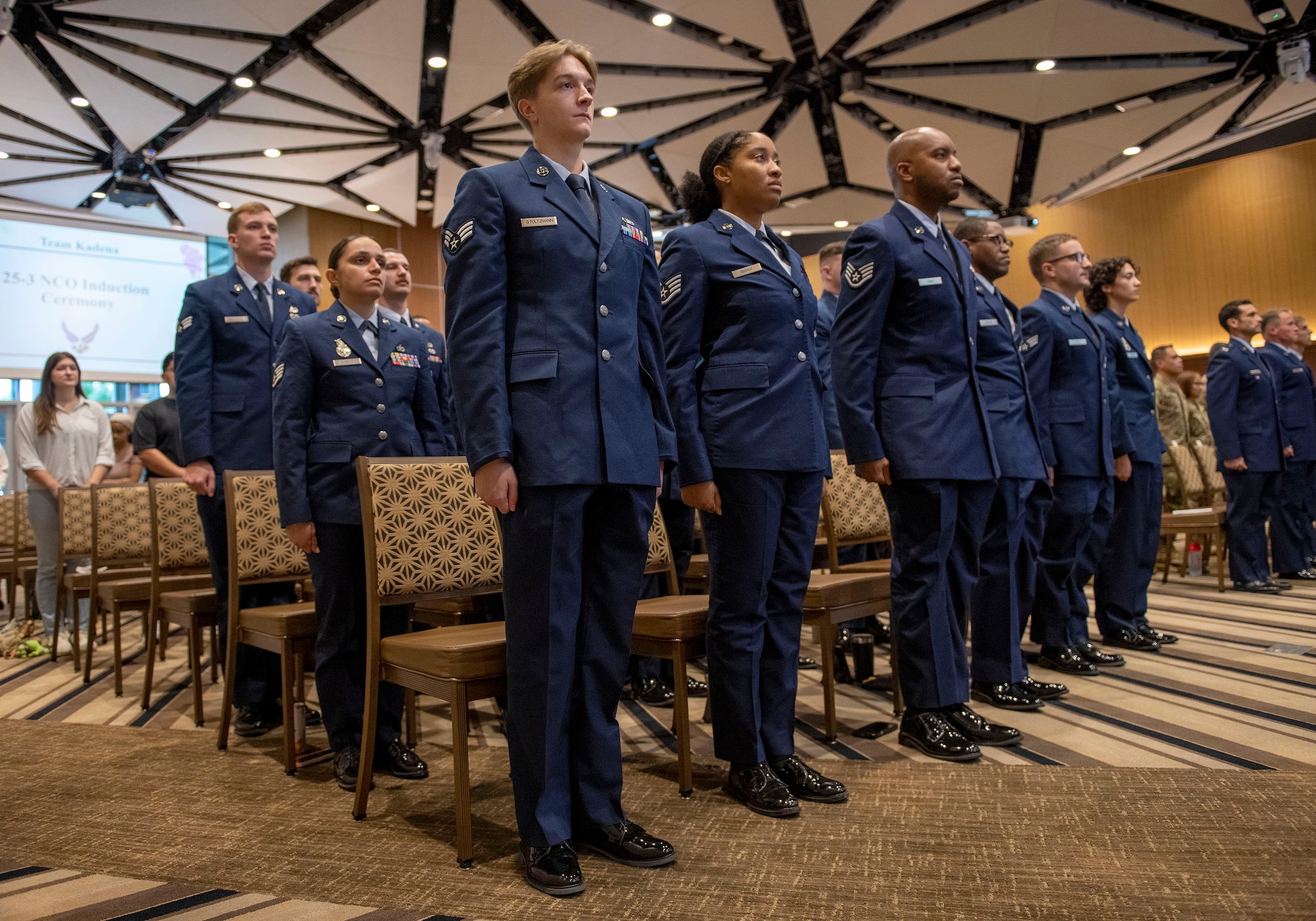 U.S. Air Force Airmen stand at attention during the Noncommissioned Officer Induction Ceremony,
