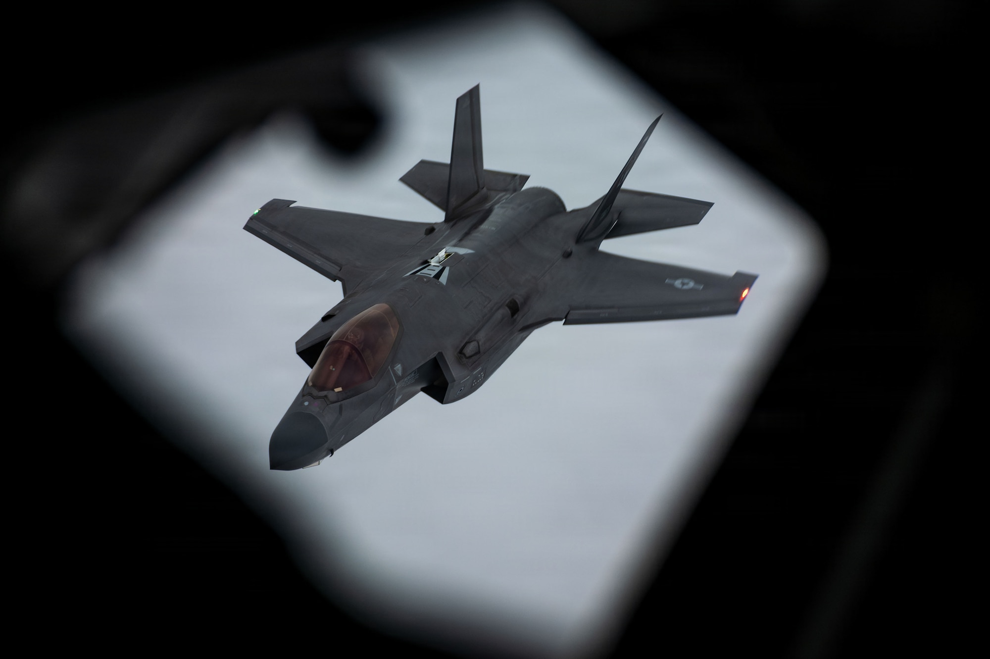 A U.S. Air Force F-35 Lightning II assigned to the 48th Fighter Wing descends from a KC-135 Stratotanker assigned to the 100th Air Refueling Wing after an air refueling mission over Poland, Nov. 19, 2025.