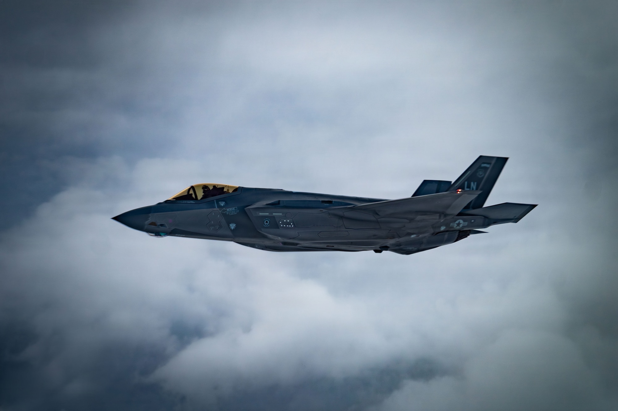 A U.S. Air Force F-35 Lightning II assigned to the 48th Fighter Wing flies in formation next to a KC-135 Stratotanker assigned to the 100th Air Refueling Wing, over Poland, Nov. 19, 2025.