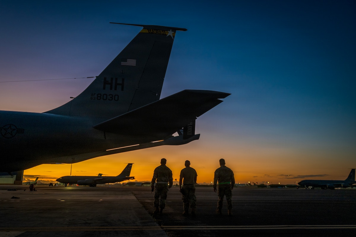 Hawaii Air National Guard Airmen conduct maintenance on a KC-135 Stratotanker at dawn prior to an aerial refueling mission at Joint Base Pearl Harbor-Hickam, Hawaii, Dec. 1, 2025. The 203rd Air Refueling Squadron provides critical aerial refueling capabilities in support of U.S. Indo-Pacific Command operations and global mobility missions worldwide. (U.S. Air National Guard photo by Senior Master Sgt. Mysti Bicoy
