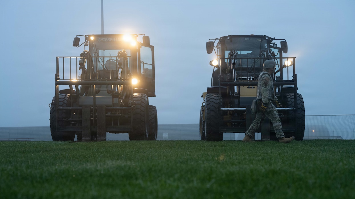 Airmen assigned to the 52nd Civil Engineer Squadron operate heavy equipment during a beddown training exercise at Spangdahlem Air Base, Germany, Dec. 5, 2025. The exercise tested Airmen's ability to rapidly establish mission-capable operations in austere environments. (U.S. Air Force photo by Senior Airman Darius Frazier)
