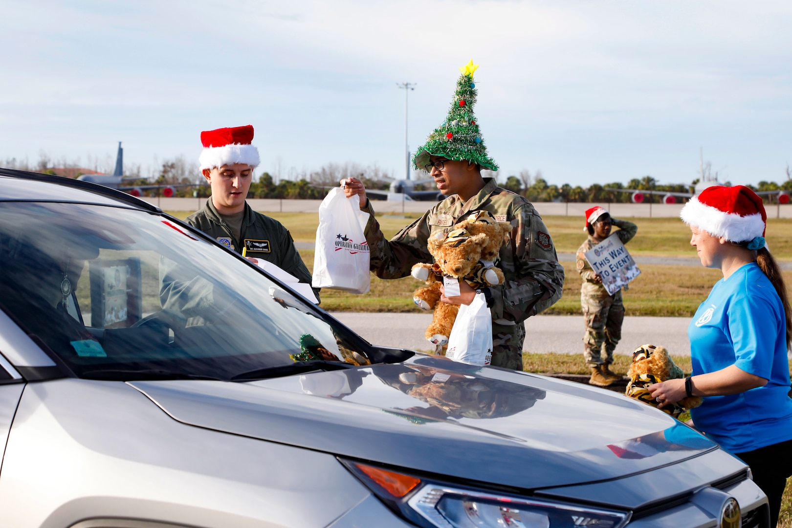 TAMPA, Fla. - Volunteers from U.S. Central Command distributed spouse care packages and Battalion Buddy Bears during Operation Gratitude, at MacDill Air Force Base, Dec. 18,2025. The event provided holiday care packages to military spouses and children of deployed service members, fostering a sense of community and support during the holiday season. (U.S. Central Command Public Affairs photo by Tom Gagnier)