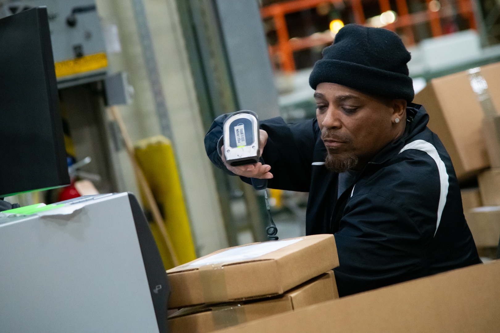 People in a warehouse learning how to use WMS.