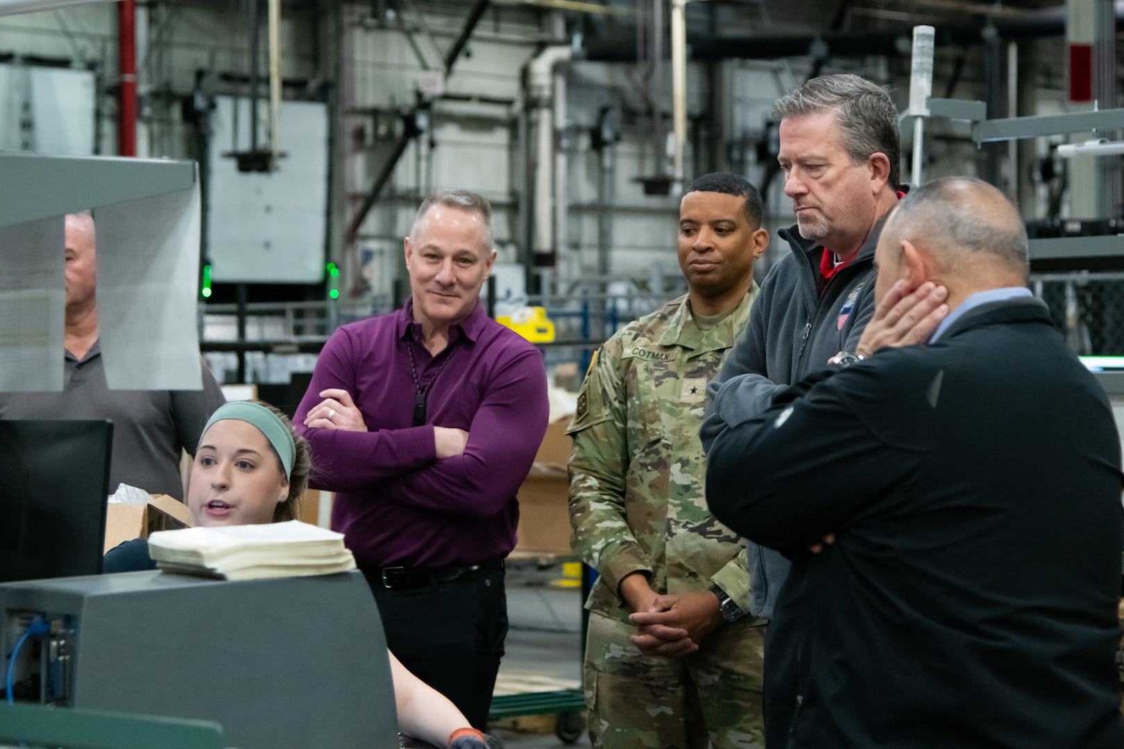 People in a warehouse learning how to use WMS.