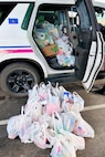 Members of the Fort Indiantown Gap police department and Fort Indiantown Gap Employees Association collected more than 6,000 food items that will be donated to area food banks to help those in need. (Courtesy photo)
