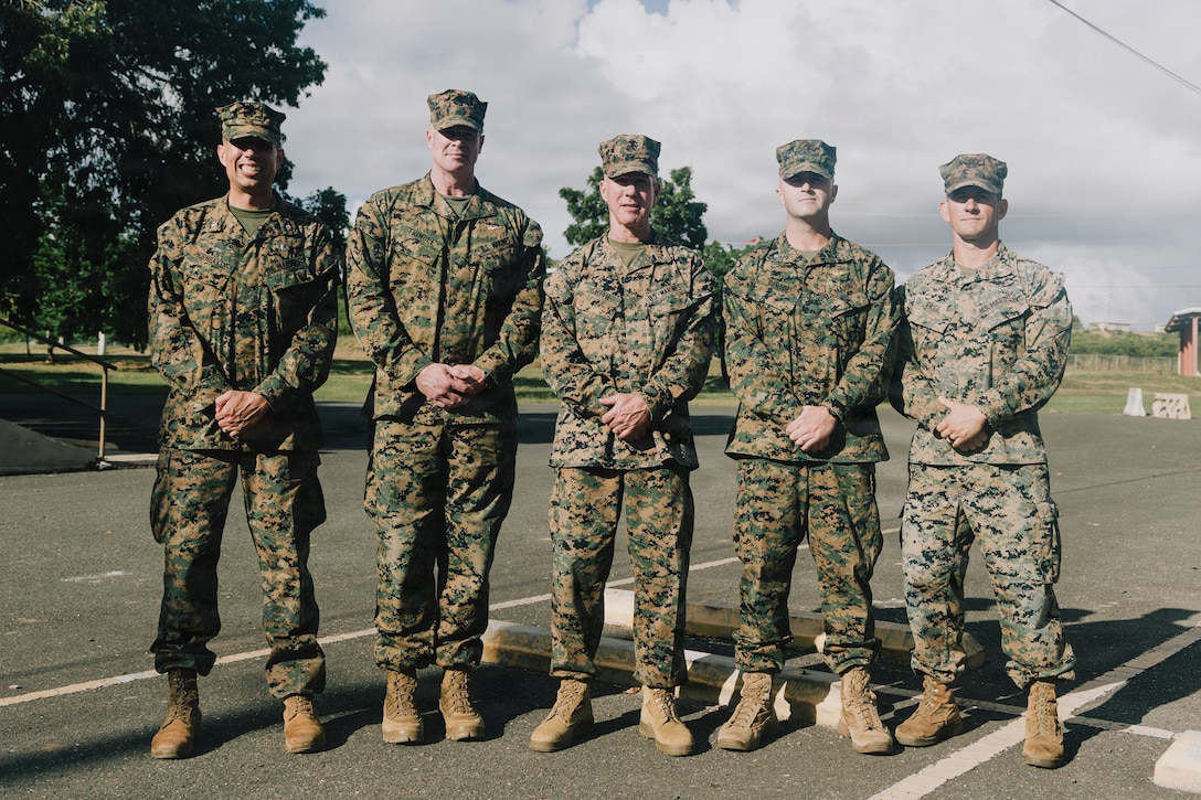 The 39th Commandant of the Marine Corps, Gen. Eric Smith, center, and commanders with the 22nd Marine Expeditionary Unit (Special Operations Capable), pose for a photo on Camp Santiago, Puerto Rico, Dec. 16, 2025. U.S. military forces are deployed to the Caribbean in support of the U.S. Southern Command mission, Department of War-directed operations, and the president's priorities to disrupt illicit drug trafficking and protect the homeland. (U.S. Marine Corps photo)