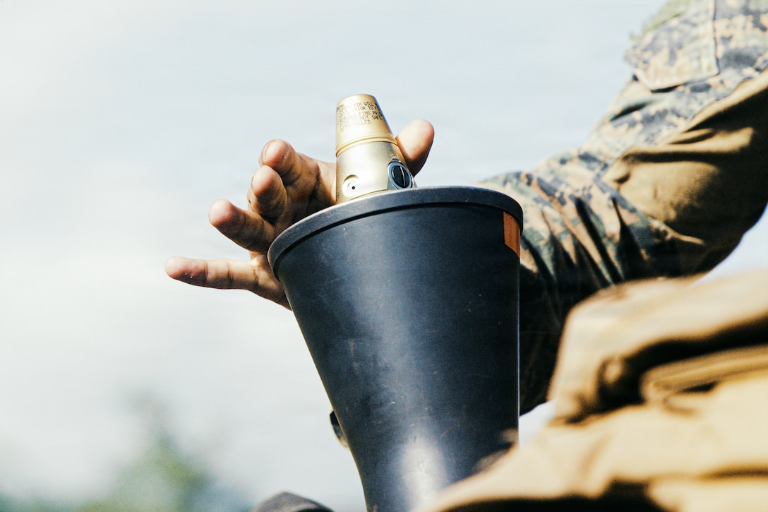 A U.S. Marine Corps mortarman with Weapons Company, Battalion Landing Team 3/6, 22nd Marine Expeditionary Unit (Special Operations Capable), fires an M252A2 81mm mortar system during a live-fire range on Camp Santiago, Puerto Rico, Dec. 5, 2025. U.S. military forces are deployed to the Caribbean in support of the U.S. Southern Command mission, Department of War-directed operations, and the president’s priorities to disrupt illicit drug trafficking and protect the homeland. (U.S. Marine Corps photo)