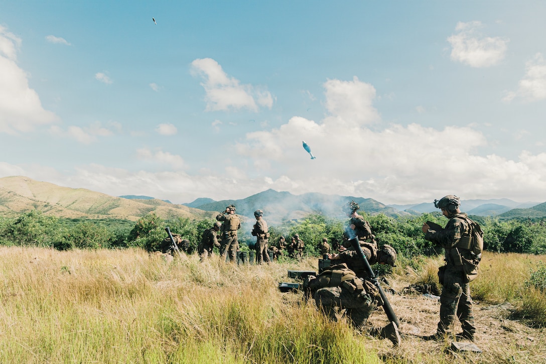 U.S. Marine Corps mortarmen with Weapons Company, Battalion Landing Team 3/6, 22nd Marine Expeditionary Unit (Special Operations Capable), fire M252A2 81mm mortar systems during a live-fire range on Camp Santiago, Puerto Rico, Dec. 13, 2025. U.S. military forces are deployed to the Caribbean in support of the U.S. Southern Command mission, Department of War-directed operations, and the president's priorities to disrupt illicit drug trafficking and protect the homeland. (U.S. Marine Corps photo)