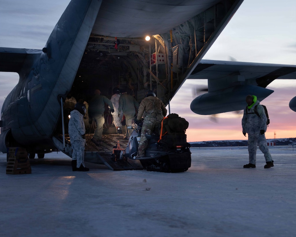 U.S. Marines and U.S. Airmen prepare to depart to town after arriving in Kotzebue, Alaska, Dec. 4, 2025. The Marines, assigned to Detachment Delta Company, 4th Law Enforcement Battalion, Force Headquarters Group and the Airmen, assigned to the 673rd Security Forces Squadron, are participating in Operation Polar Knight in support of the Toys for Tots mission reaching remote Alaskan communities. (U.S. Marine Corps photo by Cpl. Orion Stpierre)