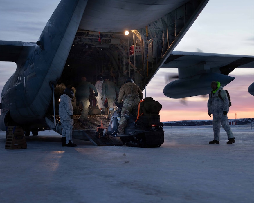U.S. Marines and U.S. Airmen prepare to depart to town after arriving in Kotzebue, Alaska, Dec. 4, 2025. The Marines, assigned to Detachment Delta Company, 4th Law Enforcement Battalion, Force Headquarters Group and the Airmen, assigned to the 673rd Security Forces Squadron, are participating in Operation Polar Knight in support of the Toys for Tots mission reaching remote Alaskan communities. (U.S. Marine Corps photo by Cpl. Orion Stpierre)