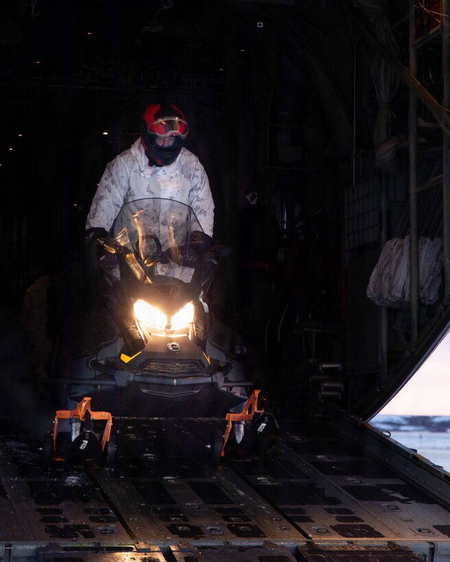 U.S. Marine Corps First Sgt. Robert Votta, unloads a Polaris snow machine in Kotzebue, Alaska, Dec. 4, 2025. Votta is an Oregon native and the I&I First Sergeant with Detachment Delta Company, 4th Law Enforcement Battalion, Force Headquarters Group. The Toys for Tots mission exemplifies the Marine Corps spirit in the last frontier, strengthening community ties while sharpening the Marines’ readiness for Arctic operations. (U.S. Marine Corps photo by Cpl. Orion Stpierre)