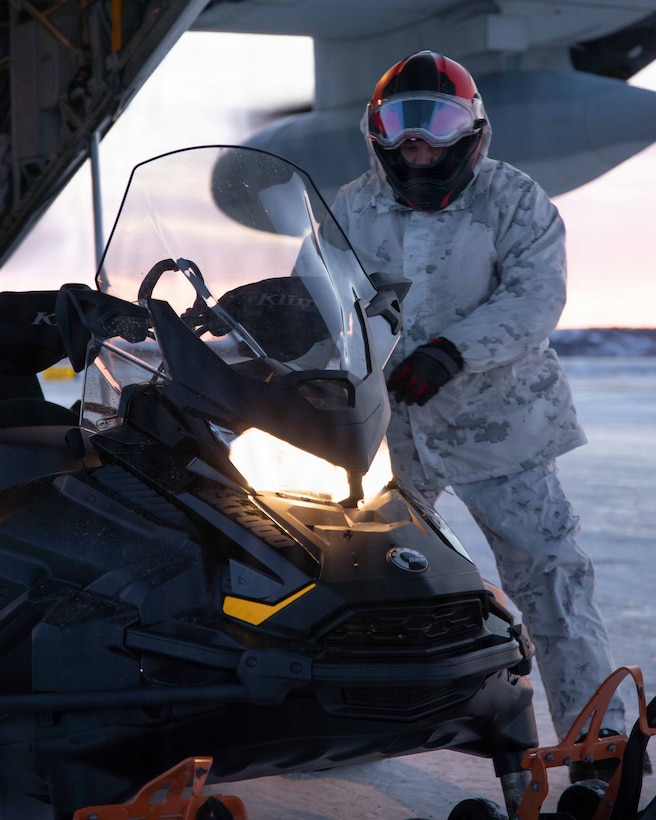 U.S. Marine Corps First Sgt. Robert Votta, prepares to take off the skags in Kotzebue, Alaska Dec. 4, 2025. Votta is an Oregon native and the I&I First Sergeant with Detachment Delta Company, 4th Law Enforcement Battalion, Force Headquarters Group. The Toys for Tots mission exemplifies the Marine Corps spirit in the last frontier, strengthening community ties while sharpening the Marines’ readiness for Arctic operations. (U.S. Marine Corps photo by Cpl. Orion Stpierre)