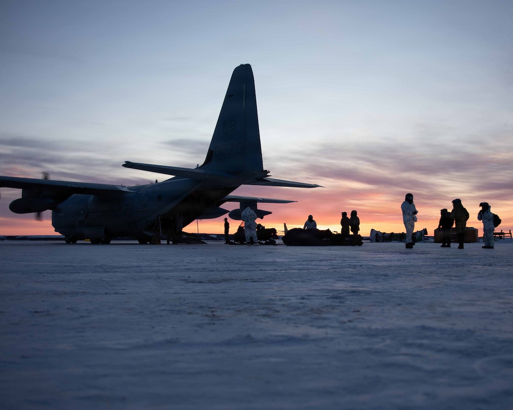 U.S. Marines and U.S. Airmen prepare to depart to town after arriving in Kotzebue, Alaska, Dec. 4, 2025. The Marines, assigned to Detachment Delta Company, 4th Law Enforcement Battalion, Force Headquarters Group and the Airmen, assigned to the 673rd Security Forces Squadron, are participating in Operation Polar Knight in support of the Toys for Tots mission reaching remote Alaskan communities. (U.S. Marine Corps photo by Cpl. Orion Stpierre)