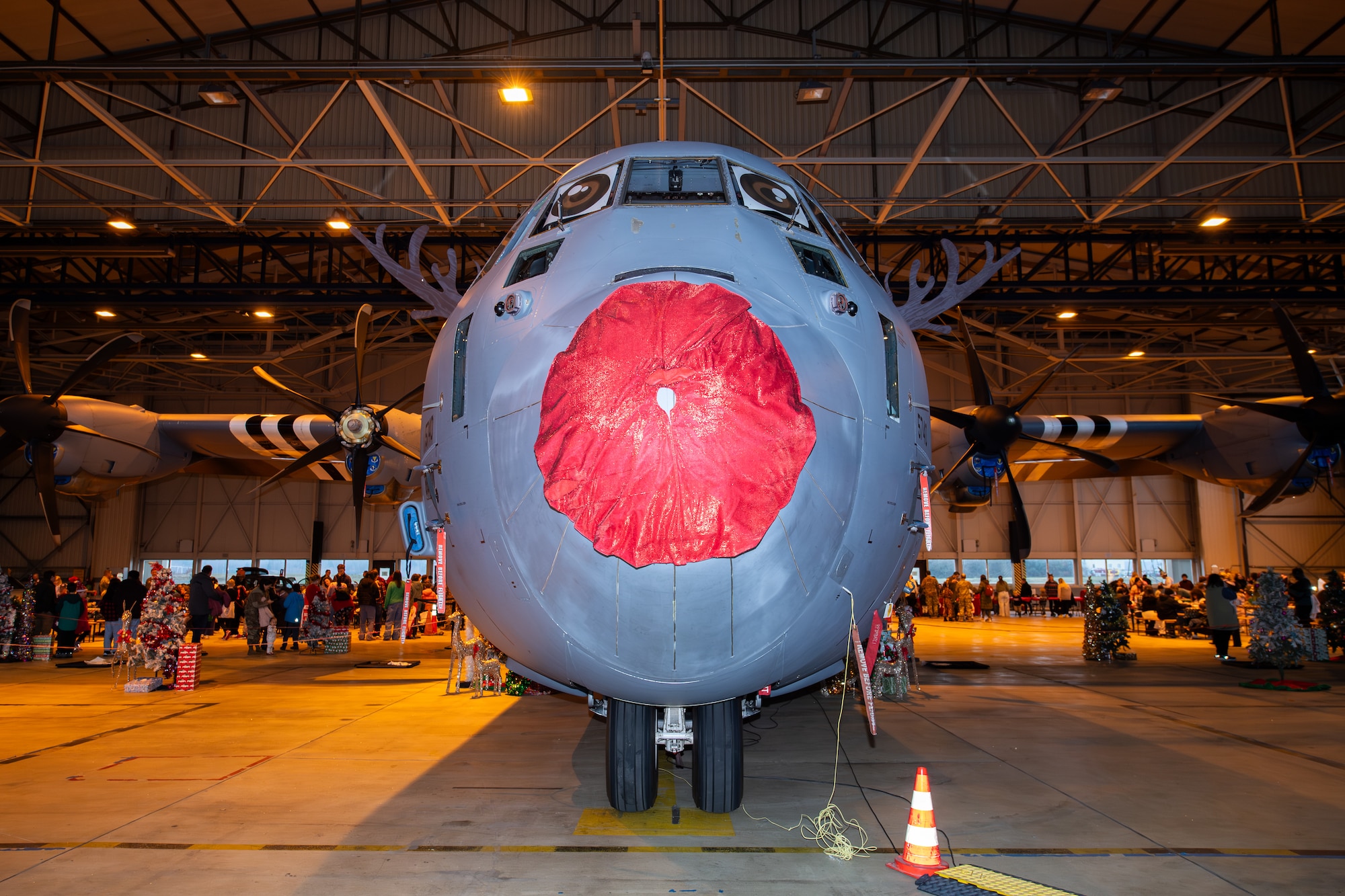 A photo of an aircraft with a red nose painted on it to look like the character Rudolph the Red Nosed Reindeer