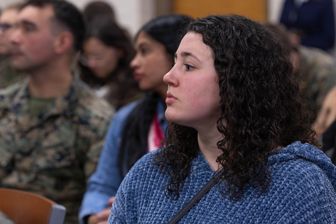 U.S. Marine Corps spouse Julia Lilly observes a presentation during the Yellow Ribbon Event at Fort Devens, Massachusetts, Dec. 13, 2025. The event provided resources, workshops and community-building opportunities to strengthen the resilience and readiness of military members and families before, during and after deployment. (U.S. Marine Corps photo by Lance Cpl. Priscilla Flores)