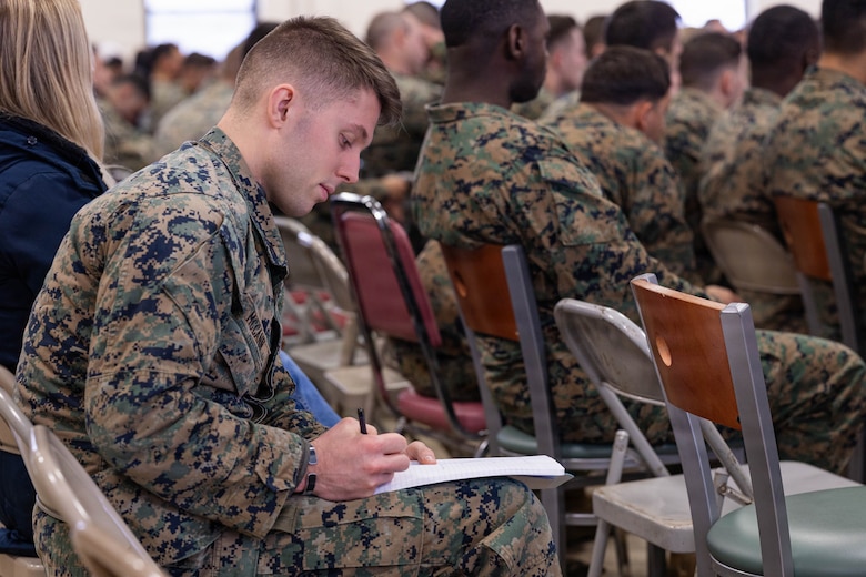 U.S. Marine Corps Cpl. Noah McCann takes notes during the Yellow Ribbon Event at Fort Devens, Massachusetts, Dec. 13, 2025. McCann is an infantryman team leader with Charlie Company, 1st Battalion, 25th Marine Regiment. The event provided resources, workshops and community-building opportunities to strengthen the resilience and readiness of military members and families before, during and after deployment. (U.S. Marine Corps photo by Lance Cpl. Priscilla Flores)