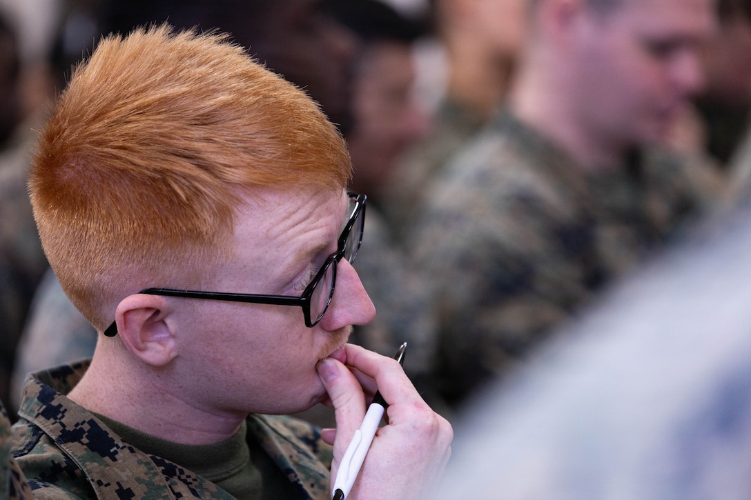 U.S. Marine Corps Lance Cpl. Matthew Brooks listens to a presentation during the Yellow Ribbon Event at Fort Devens, Massachusetts, Dec. 13, 2025. Brooks is a rifleman with Charlie Company, 1st Battalion, 25th Marine Regiment. The event provided resources, workshops and community-building opportunities to strengthen the resilience and readiness of military members and families before, during and after deployment. (U.S. Marine Corps photo by Lance Cpl. Priscilla Flores)