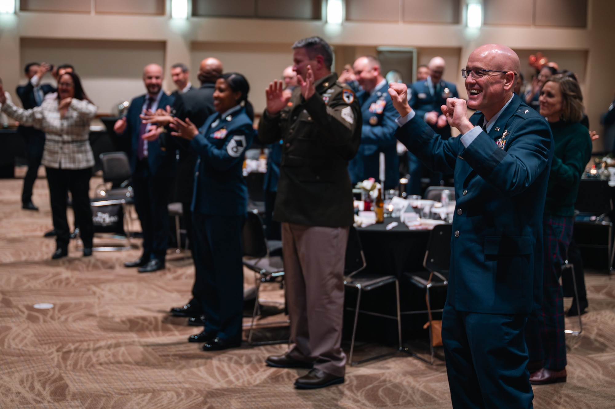 crowd claps and dances