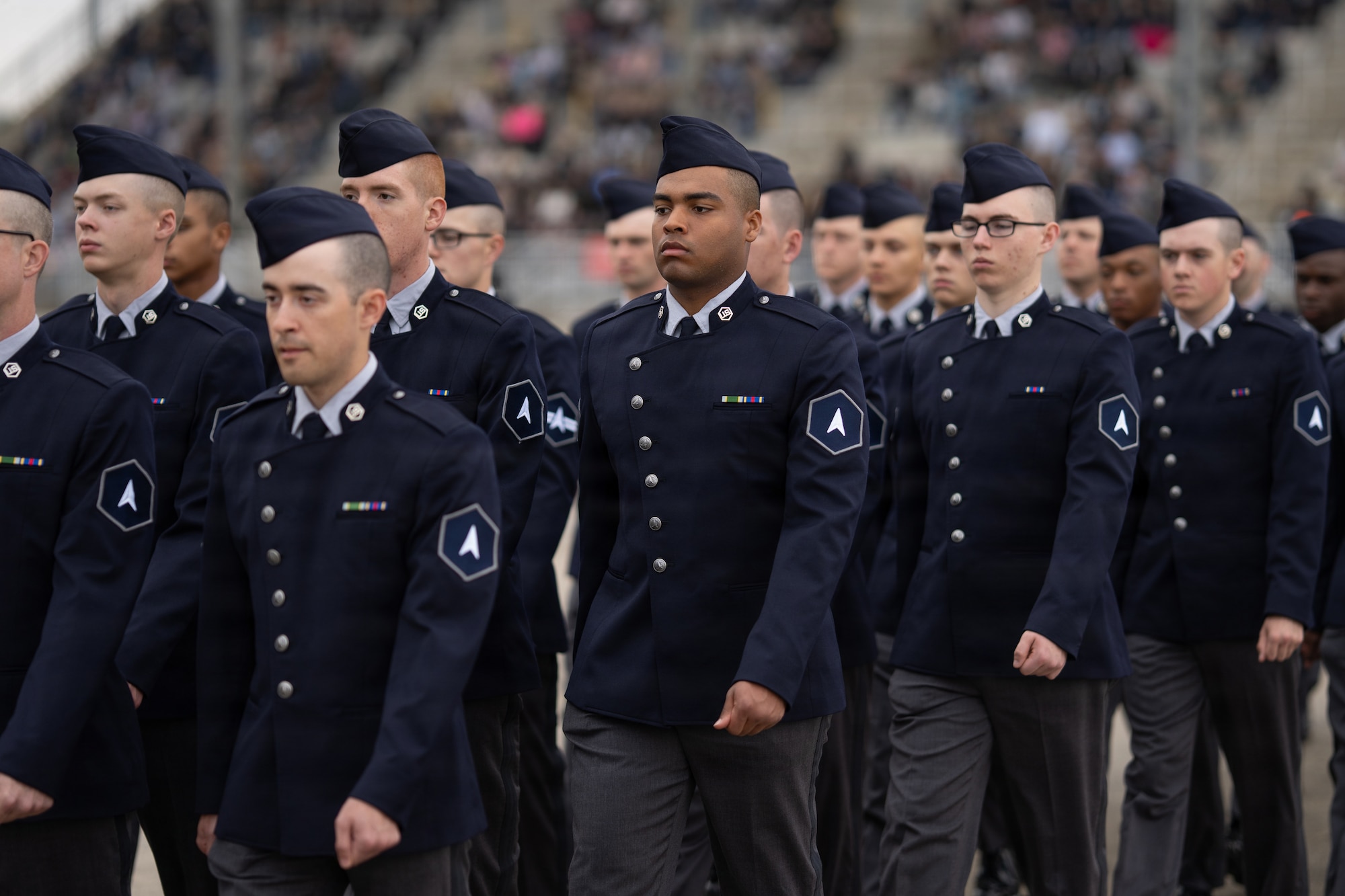 Guardians march during a basic military training graduation ceremony.