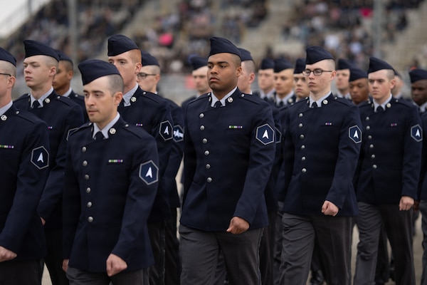 Guardians march during a basic military training graduation ceremony.