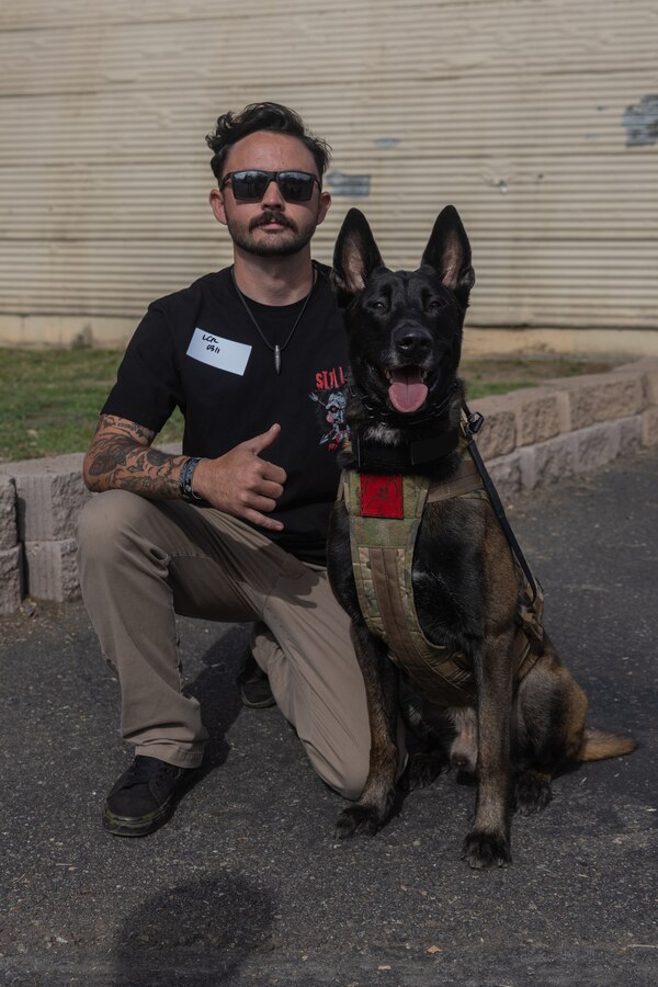 Cpl. Tyler Reed poses for a photo with his dog Doden during an Individual Ready Reserve (IRR) Muster at Camp Pendleton, California, Dec. 14, 2025. Reed is a Marine in the IRR. During these muster events, Marine Corps Individual Reserve Support Activity (MCIRSA) conducts an administrative screening of IRR Marines to ensure their readiness to augment and reinforce the active component. (U.S. Marine Corps photo by Sgt. Emily De La Torre)