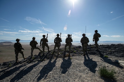 Soldiers assigned to the 19th Special Forces Group (Airborne), Utah National Guard, look over the area of operations during Exercise Hydra at the Utah Test and Training Range, May 8, 2025. The exercise serves to prepare participants to respond decisively to complex threats across all domains. (Photo by U.S. Air Force Master Sgt. Danny Whitlock)