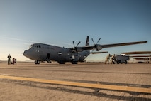 a person stands in front of an aircraft