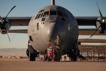 a person stands in front of an aircraft