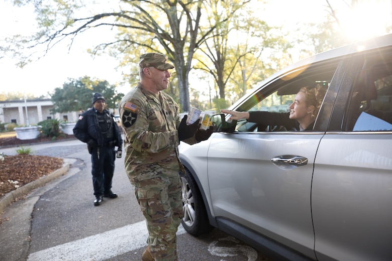 Employees greeted their coworkers and collected canned goods as they arrived at the ERDC gates — an effort that brought in 2,500 pounds of food.