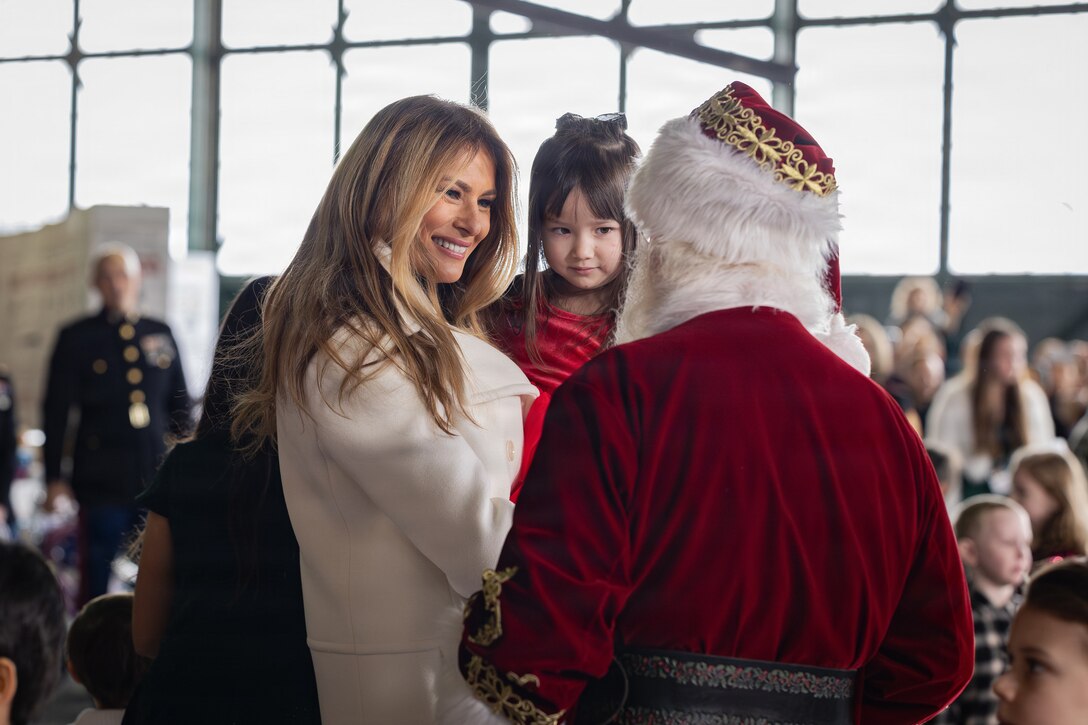 First lady of the United States, Melania Trump, talks with Santa Claus during a Toys for Tots charity event on Marine Corps Base Quantico, Virginia, Dec. 8, 2025. Since 1947, the Marine Corps Reserve has spearheaded the Toys for Tots program nationwide to collect toys for less fortunate children during the holiday season. Presently, the program distributes 7 to 18 million toys to children annually. (U.S. Marine Corps photo by Lance Cpl. Van Hoang)