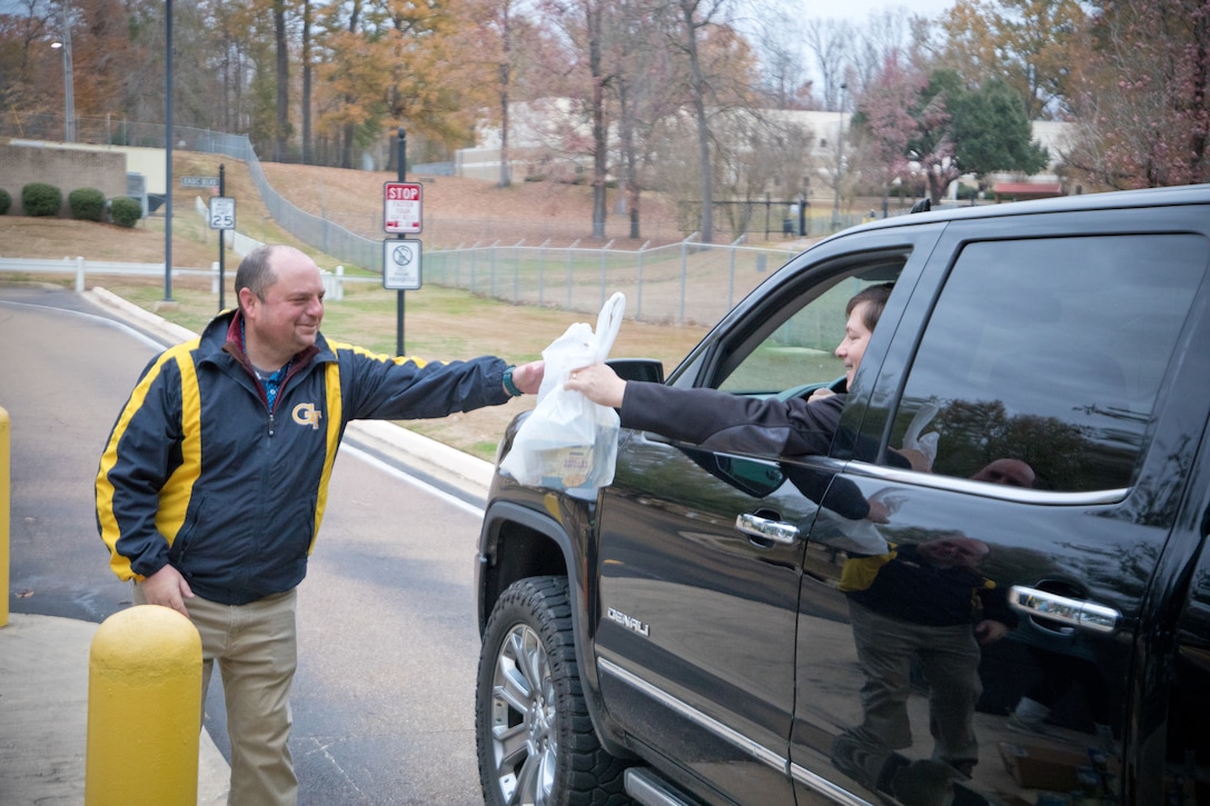 Employees greeted their coworkers and collected canned goods as they arrived at the ERDC gates — an effort that brought in 2,500 pounds of food.