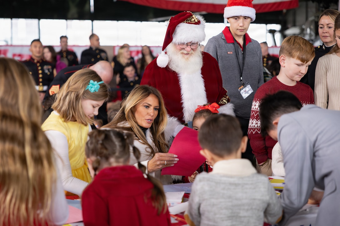 First lady of the United States, Melania Trump, draws and writes Christmas cards with children during a Toys for Tots charity event on Marine Corps Base Quantico, Virginia, Dec. 8, 2025. Since 1947, the Marine Corps Reserve has spearheaded the Toys for Tots program nationwide to collect toys for less fortunate children during the holiday season. Presently, the program distributes 7 to 18 million toys to children annually. (U.S. Marine Corps photo by Lance Cpl. Van Hoang)