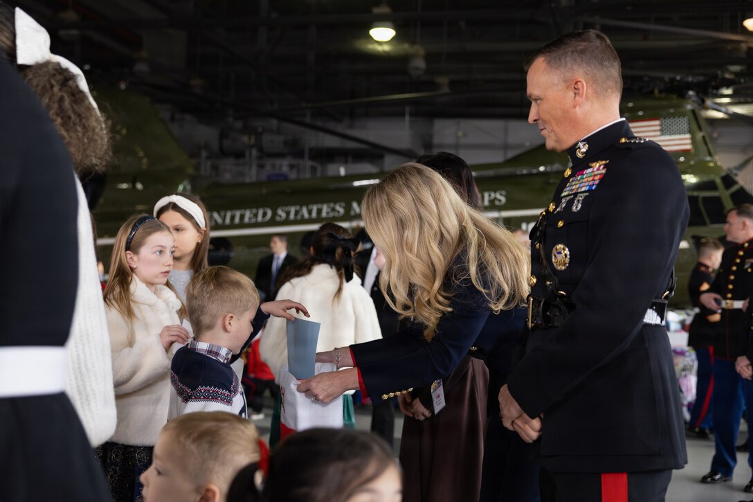 U.S. Marine Corps Lt. Gen. Leonard F. Anderson IV, commander, Marine Forces Reserve and Marine Forces South, talks to the first lady of the United States, Melania Trump, during a Toys for Tots charity event on Marine Corps Base Quantico, Virginia, Dec. 8, 2025. Since 1947, the Marine Corps Reserve has spearheaded the Toys for Tots program nationwide to collect toys for less fortunate children during the holiday season. Presently, the program distributes 7 to 18 million toys to children annually. (U.S. Marine Corps photo by Lance Cpl. Van Hoang)