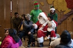 Members of the Alaska Air and Army National Guard and the Department of Homeland Security, along with volunteers from the Salvation Army and the Alaska National Guard Child and Youth Program, hosted families from Kipnuk and Kwigillingok during Operation Santa Claus 2025 at the Alaska Native Heritage Center in Anchorage, Alaska, on Dec. 14, 2025. Operation Santa Claus, a longstanding annual Alaska National Guard community outreach program, has provided gifts, toys, backpacks and books to children in remote Alaskan communities since 1956. The program partners with the Salvation Army and numerous volunteers to spread holiday cheer and continue its tradition of support. This year’s event supported families who were displaced following Typhoon Halong and provided an opportunity for continued engagement with impacted Western Alaska communities. Photo by Alejandro Peña.