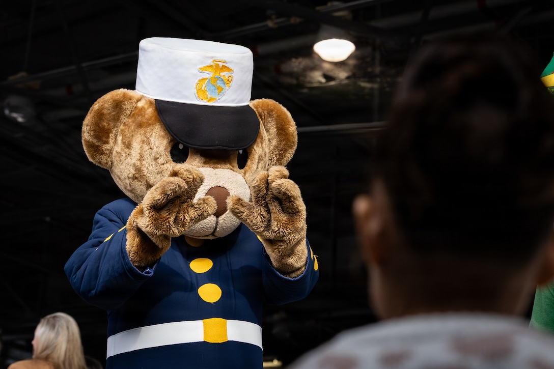 Gunny Bear greets guests during a Toys for Tots charity event on Marine Corps Base Quantico, Virginia, Dec. 8, 2025. Since 1947, the Marine Corps Reserve has spearheaded the Toys for Tots program nationwide to collect toys for less fortunate children during the holiday season. Presently, the program distributes 7 to 18 million toys to children annually. (U.S. Marine Corps photo by Lance Cpl. Van Hoang)