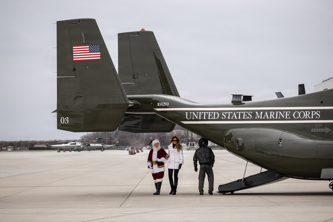 First lady of the United States, Melania Trump, right, and Santa Claus arrive to a Toys for Tots charity event on Marine Corps Base Quantico, Virginia, Dec. 8, 2025. Since 1947, the Marine Corps Reserve has spearheaded the Toys for Tots program nationwide to collect toys for less fortunate children during the holiday season. Presently, the program distributes 7 to 18 million toys to children annually. (U.S. Marine Corps photo by Lance Cpl. Van Hoang)
