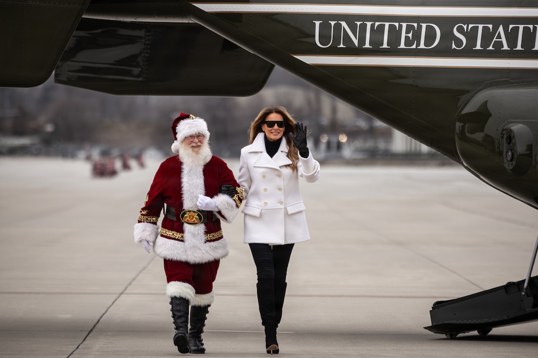 First lady of the United States, Melania Trump, right, and Santa Claus arrive to a Toys for Tots charity event on Marine Corps Base Quantico, Virginia, Dec. 8, 2025. Since 1947, the Marine Corps Reserve has spearheaded the Toys for Tots program nationwide to collect toys for less fortunate children during the holiday season. Presently, the program distributes 7 to 18 million toys to children annually. (U.S. Marine Corps photo by Lance Cpl. Van Hoang)