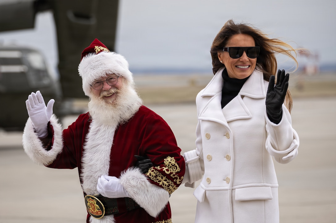 First lady of the United States, Melania Trump, right, and Santa Claus arrive to a Toys for Tots charity event on Marine Corps Base Quantico, Virginia, Dec. 8, 2025. Since 1947, the Marine Corps Reserve has spearheaded the Toys for Tots program nationwide to collect toys for less fortunate children during the holiday season. Presently, the program distributes 7 to 18 million toys to children annually. (U.S. Marine Corps photo by Lance Cpl. Van Hoang)