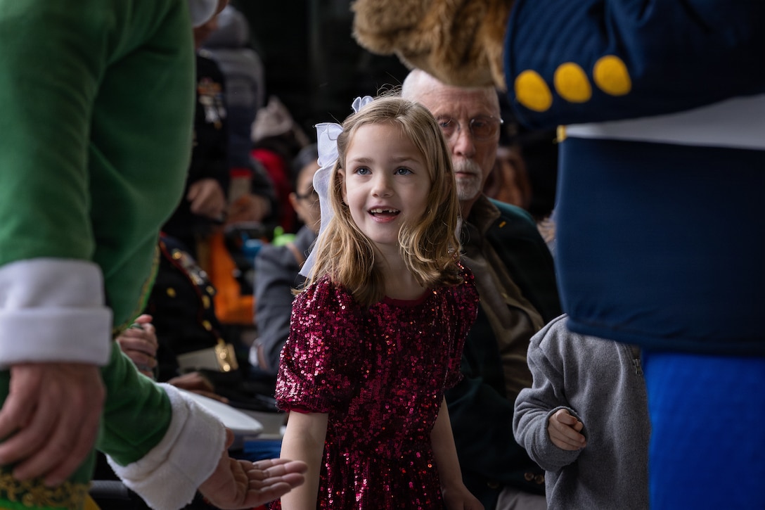 A child plays with Buddy the elf and Gunny Bear during a Toys for Tots event on Marine Corps Base Quantico, Virginia, Dec. 8, 2025. Since 1947, the Marine Corps Reserve has spearheaded the Toys for Tots program nationwide to collect toys for less fortunate children during the holiday season. Presently, the program distributes 7 to 18 million toys to children annually. (U.S. Marine Corps photo by Lance Cpl. Van Hoang)