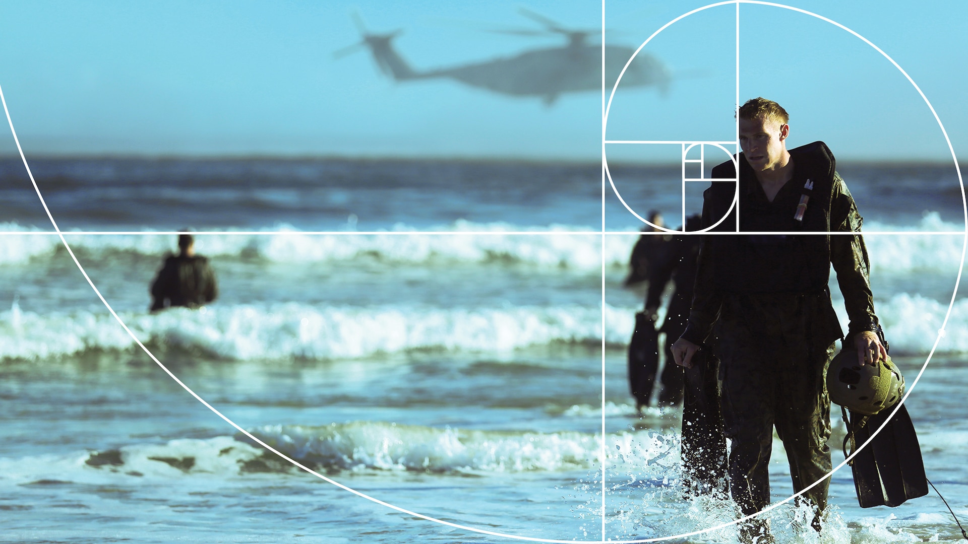 A helicopter hovers above the ocean in the distance, as four service members, at varying positions and depths of field, emerge from the water with a golden ratio overlay on the image.