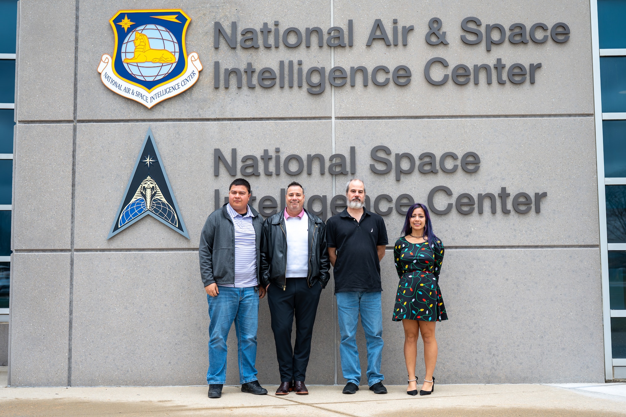 The Beiring family, from left, Michael Beiring, Christopher Beiring, Anthony Beiring, and Veronica Beiring, pose for a photo outside NASIC.