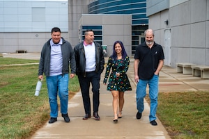 From left, Michael Beiring, Veronica Beiring, Anthony Beiring, and Christopher Beiring, go for a walk during their lunch hour.